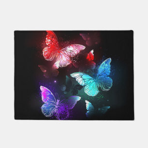 Three Glowing Butterflies on night background Doormat