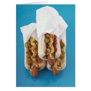 Three hot dogs in buns