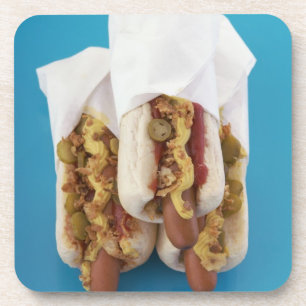 Three hot dogs in buns coaster