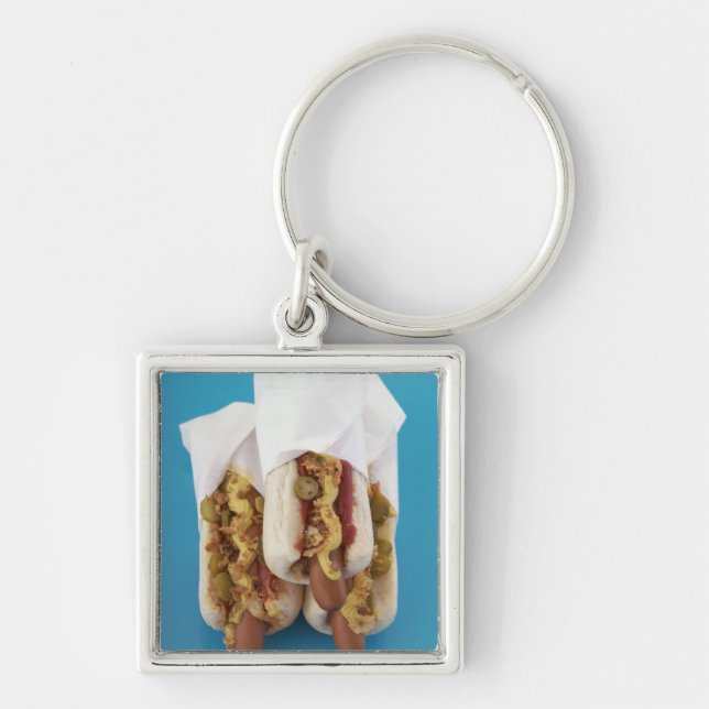 Three hot dogs in buns keychain (Front)