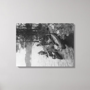 Three Hunters with Canoes at Shore Photograph Canvas Print