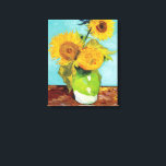 Three Sunflowers | Vincent van Gogh Canvas Print<br><div class="desc">Three Sunflowers (1888) by Vincent van Gogh is a vibrant still life that showcases the artist’s signature thick brushstrokes and bold use of color. The painting features three sunflowers in a simple vase, their golden petals contrasting against the aqua blue background. Van Gogh's vivid yellow palette brings energy and life...</div>