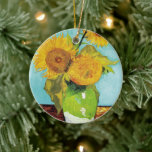 Three Sunflowers | Vincent van Gogh Ceramic Ornament<br><div class="desc">Three Sunflowers (1888) by Vincent van Gogh is a vibrant still life that showcases the artist’s signature thick brushstrokes and bold use of colour. The painting features three sunflowers in a simple vase, their golden petals contrasting against the aqua blue background. Van Gogh's vivid yellow palette brings energy and life...</div>