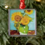 Three Sunflowers | Vincent van Gogh Metal Ornament<br><div class="desc">Three Sunflowers (1888) by Vincent van Gogh is a vibrant still life that showcases the artist’s signature thick brushstrokes and bold use of colour. The painting features three sunflowers in a simple vase, their golden petals contrasting against the aqua blue background. Van Gogh's vivid yellow palette brings energy and life...</div>