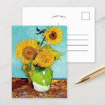 Three Sunflowers | Vincent van Gogh Postcard<br><div class="desc">Three Sunflowers (1888) by Vincent van Gogh is a vibrant still life that showcases the artist’s signature thick brushstrokes and bold use of color. The painting features three sunflowers in a simple vase, their golden petals contrasting against the aqua blue background. Van Gogh's vivid yellow palette brings energy and life...</div>