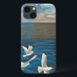 Three White Seagulls Flying Over the Water iPhone 13 Case<br><div class="desc">Need to get away? Do it by choosing this painting by artist Tara Friel representing three seagulls flying over the water. The sight of the waves of the ocean and the vivid colours make this design very realistic.</div>