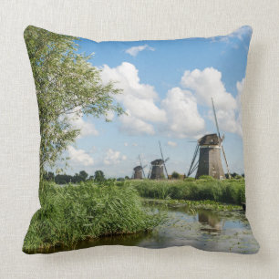 Three windmills and a canal throw pillow