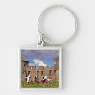Three young women in traditional clothes keychain