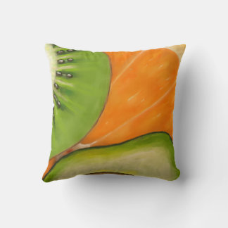 Throw pillow with avocado, orange and kiwi.