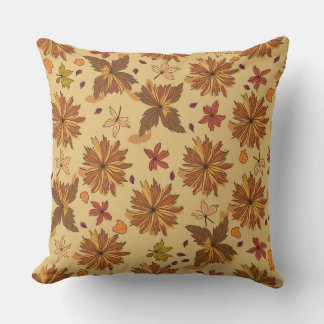 Throw pillow with fallen leaves