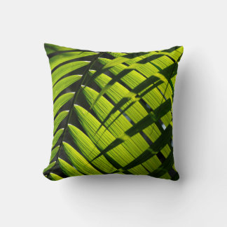 Throw pillow with palm leaf design