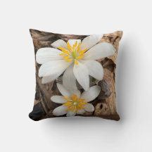 Throw pillow with white wildflower
