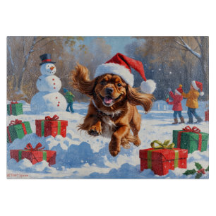 Tibetan Spaniel Running in Snow with Christmas Hat Cutting Board