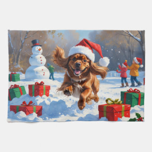 Tibetan Spaniel Running in Snow with Christmas Hat Kitchen Towel