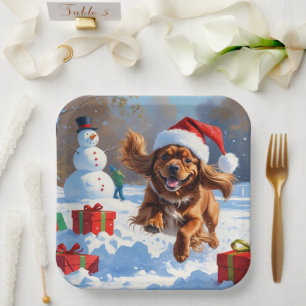 Tibetan Spaniel Running in Snow with Christmas Hat Paper Plate