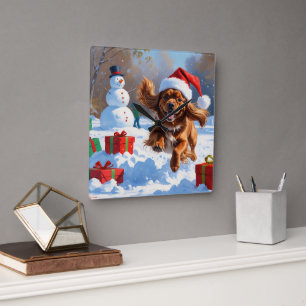 Tibetan Spaniel Running in Snow with Christmas Hat Square Wall Clock