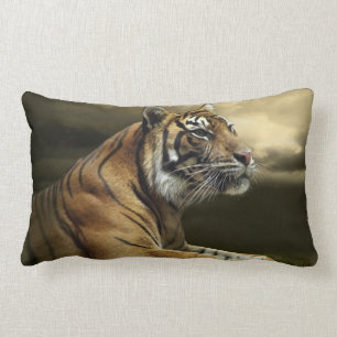 Tiger looking and sitting under dramatic sky lumbar pillow
