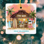 Tiki Beach Tropical Sunset Mele Kalikimaka Santa Ceramic Ornament<br><div class="desc">Tropical Christmas ornament features Santa enjoying a vacation at a Tiki bar on the beach at sunset with palm trees, string lights and Hawaiian "Aloha" and "Mele Kalikimaka" greetings. Tropical cocktails, a pineapple, hibiscus and palm leaves, a surfboard and a parrot in a pirate hat decorate the bar area. Personalize...</div>