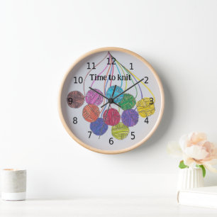 Time to knit, many balls of yarn, with your words clock