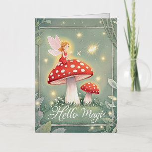 Tiny fairy perched on top of mushroom and glowing  foil greeting card