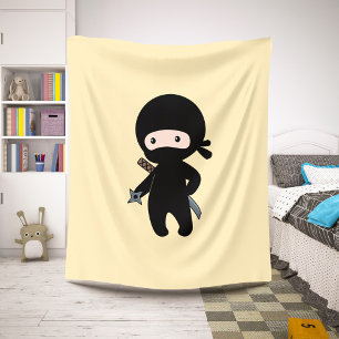 Tiny Ninja Holding Throwing Star on Yellow Sherpa Blanket
