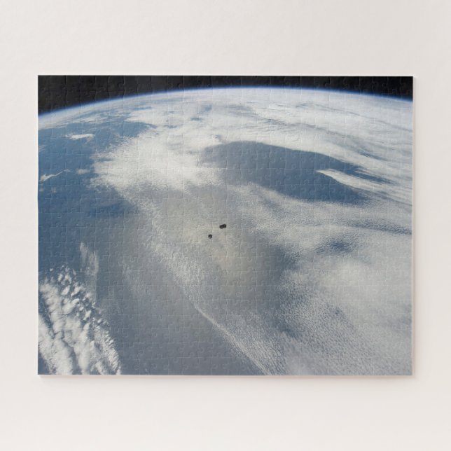 Tiny Satellites Orbit Above A Part Of Earth. Jigsaw Puzzle (Horizontal)
