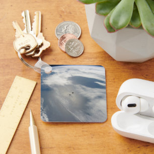Tiny Satellites Orbit Above A Part Of Earth. Keychain