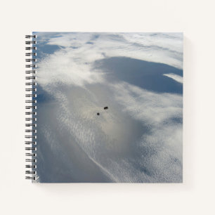 Tiny Satellites Orbit Above A Part Of Earth. Notebook