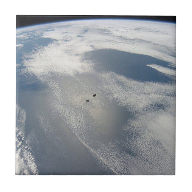 Tiny Satellites Orbit Above A Part Of Earth. Tile (Front)