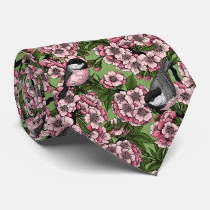 Tit birds in the lilac garden tie