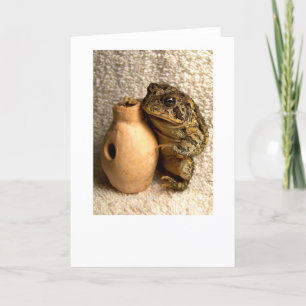 Toad frog holding miniature udu photograph card