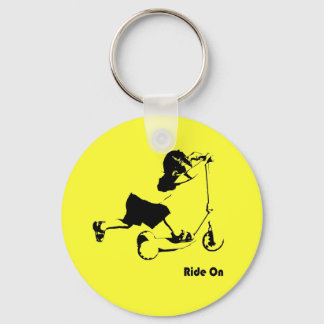 Toddler riding scooter keychain