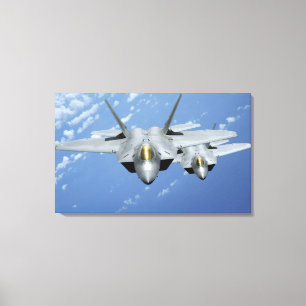 Toile Mouche de deux F-22 Raptors au-dessus de l'océan