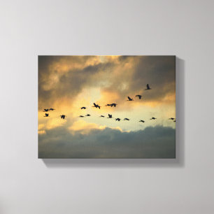 Toile Oiseaux hérons qui migrent au coucher du soleil