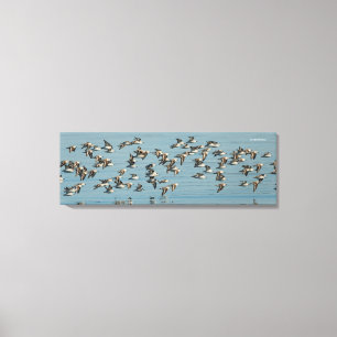 Toile Sanderlings prend l'avion dans le ciel d'hiver