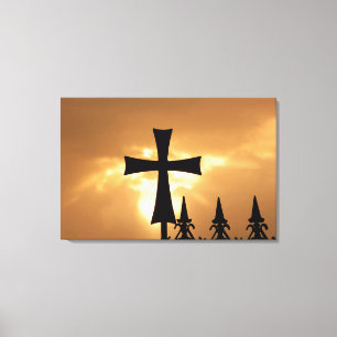 Toile Une croix en fer forgé sur une clôture
