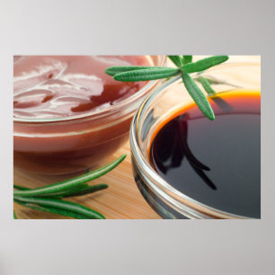 Tomato ketchup and soy sauce in a transparent bowl poster
