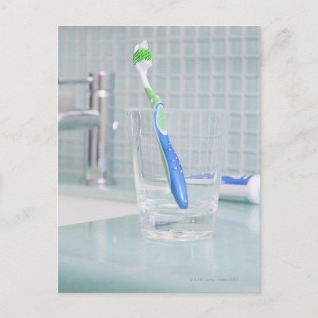 Toothbrush in a cup in the bathroom postcard (Front)