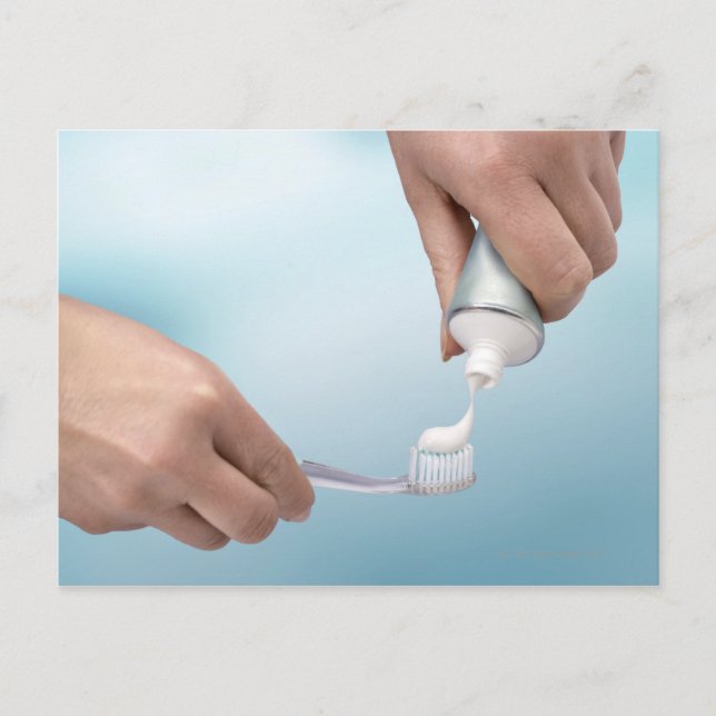 Toothpaste being squeezed onto a brush postcard (Front)