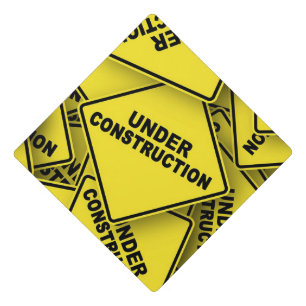 Toque De Diplômé Signes de construction en cours