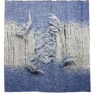 Torn blue denim: jeans texture.