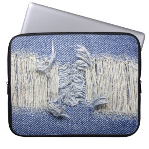 Torn blue denim: jeans texture. laptop sleeve