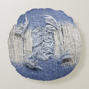 Torn blue denim: jeans texture. round pillow