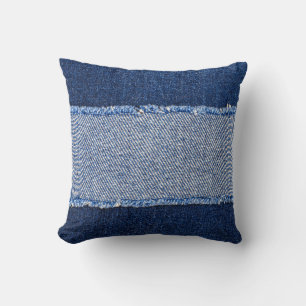 Torn denim: blue jeans fabric. throw pillow