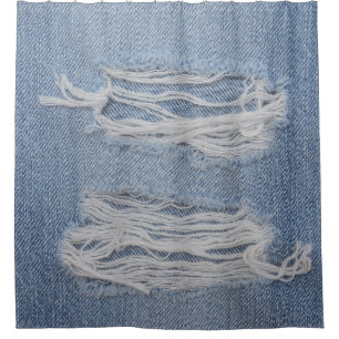 Torn denim: blue jeans texture.
