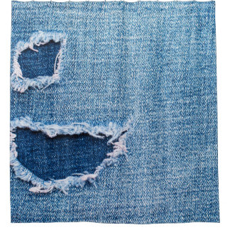 Torn denim fabric texture, blue hues.