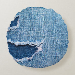 Torn denim fabric texture, blue hues. round pillow