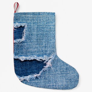 Torn denim fabric texture, blue hues. small christmas stocking