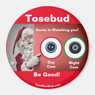 Tosebud Père Noël regarde Magnet