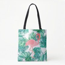 flamant rose sur feuilles verts tropicaux